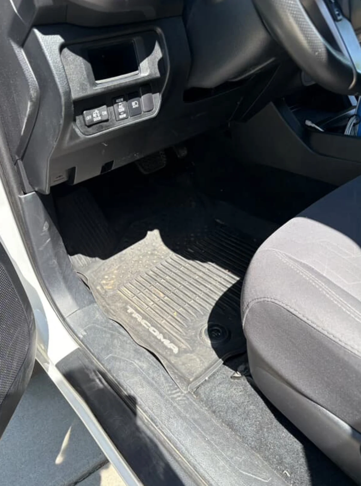 Dusty and dirty car dashboard and console before interior detailing