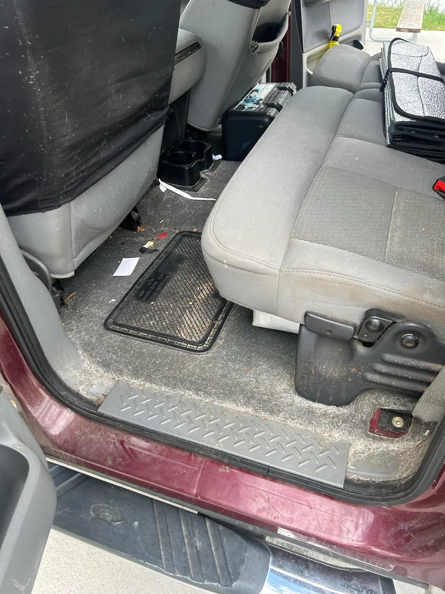 Heavily soiled white work truck before professional exterior detailing